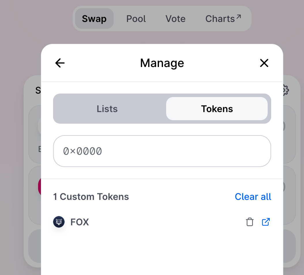 Uniswap custom token management screen showing a FOX token contract entry