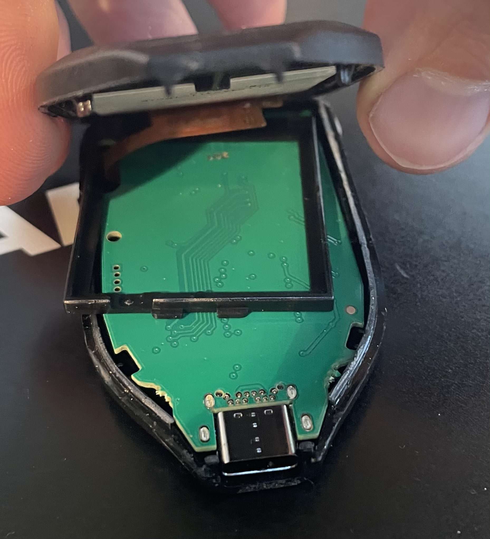 Opened Trezor Model T case showing the internal display and motherboard assembly